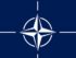 Nato-Symbol / Quelle: By Current file: Found by 475847394d347339 in websites noted in the source section. Previous file: Vectorized by Mysid and uploaded to Flag of NATO.svg Code cleaned up by Artem Karimov. [Public domain], via Wikimedia Commons