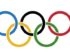 Die olympischen Ringe / Wikipedia:By Original author: Pierre de Coubertin (1863-1937) (Manual reconstruction by Denelson83) [Public domain], via Wikimedia Commons; https://upload.wikimedia.org/wikipedia/commons/a/a7/Olympic_flag.svg